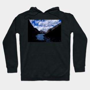 Kayaking in the mountains shadows Hoodie